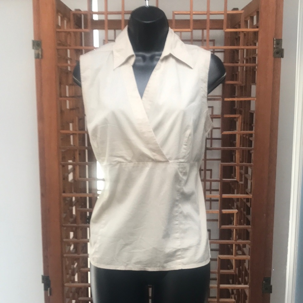 Size 10 tan blouse with zipper.